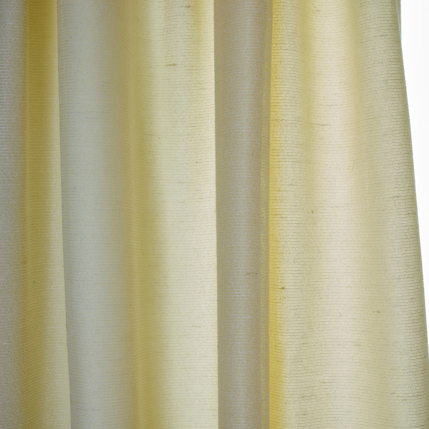 Close-up of Ann Gish Gather curtain panel in ivory, showing draped linen weave texture.