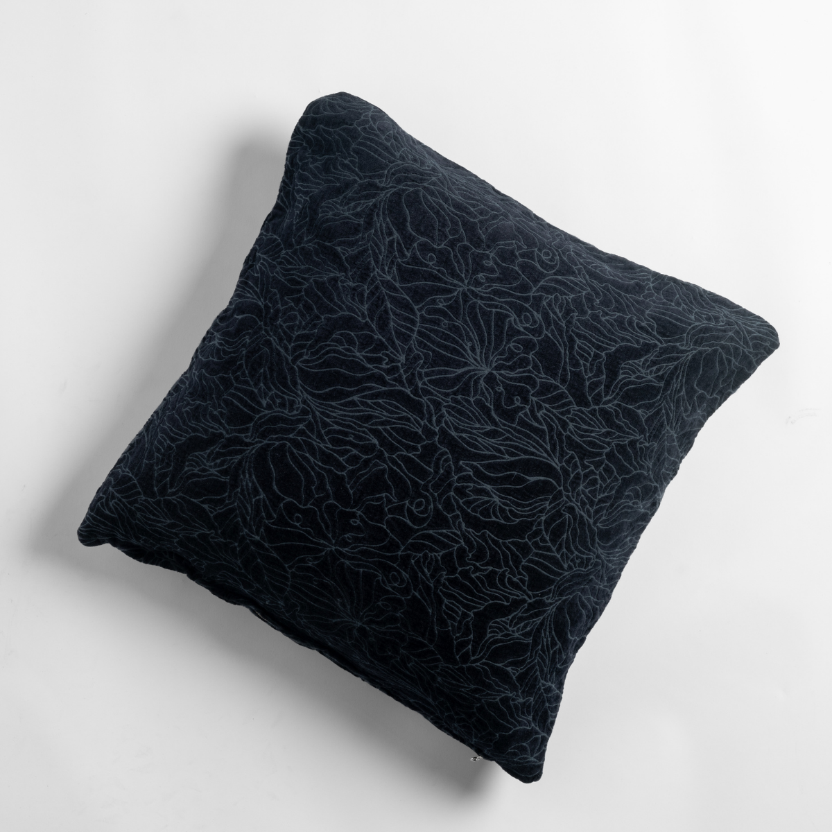 Slate Georgia throw pillow, close-up showing tonal floral embroidery on deep navy velvet.