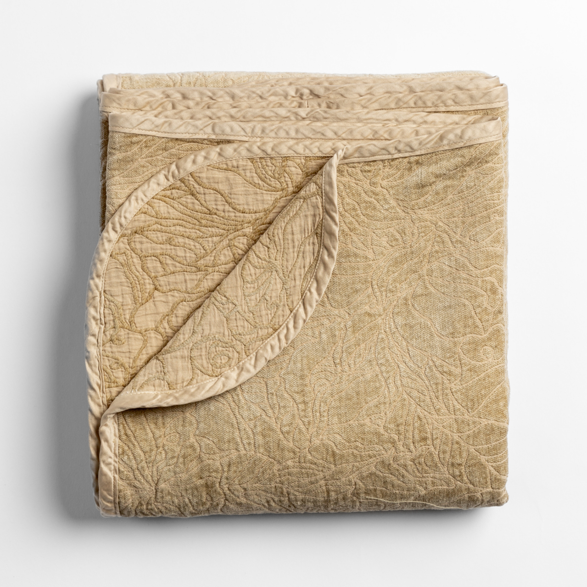 Bella Notte Georgia blanket in Honeycomb, folded with corner turned to show quilted texture.