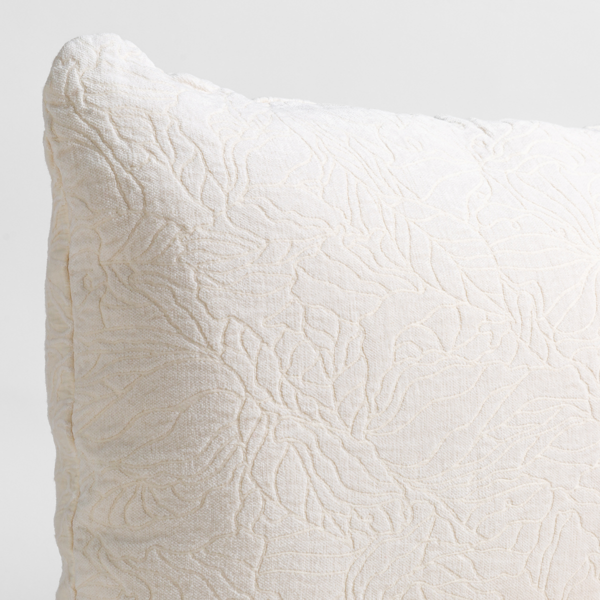 Close-up of Bella Notte Georgia sham corner in Winter White with tonal floral matelassé texture.