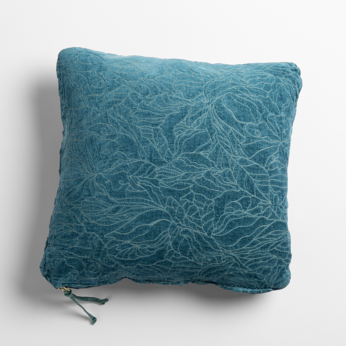 Cenote velvet throw pillow with allover leaf embroidery pattern, zipper closure visible at bottom.