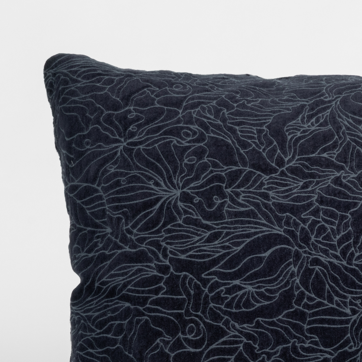 Close-up of Bella Notte Georgia sham corner in Slate, showing floral outline embroidery on velvet.