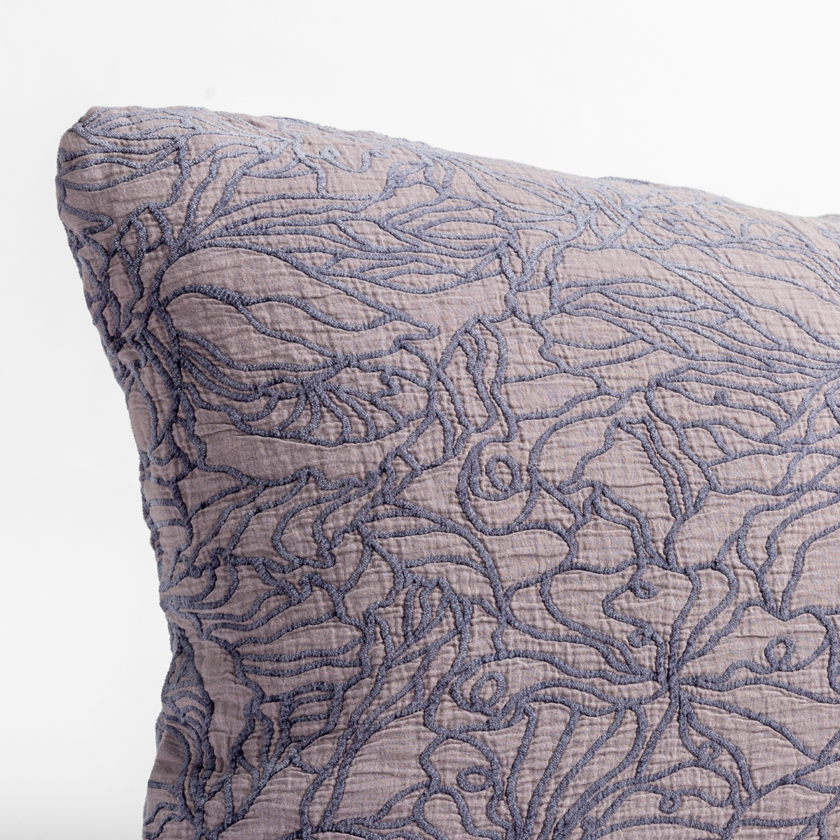 Close-up of French Lavender Georgia throw pillow showing intricate floral quilted stitching detail.
