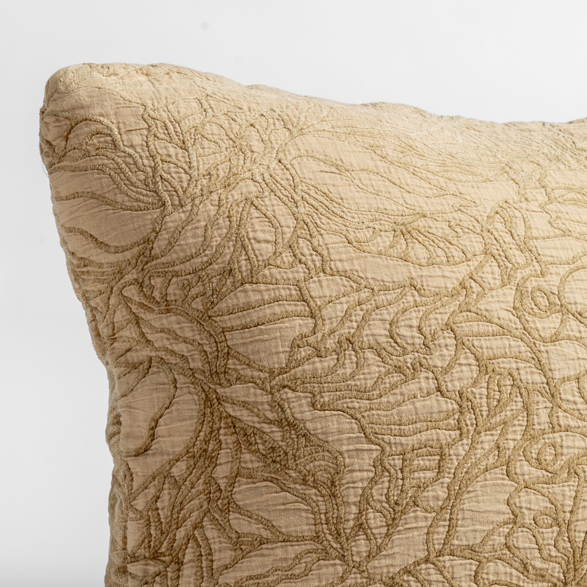 Close-up of Bella Notte Georgia sham in Honeycomb, showing quilted floral stitch detail.