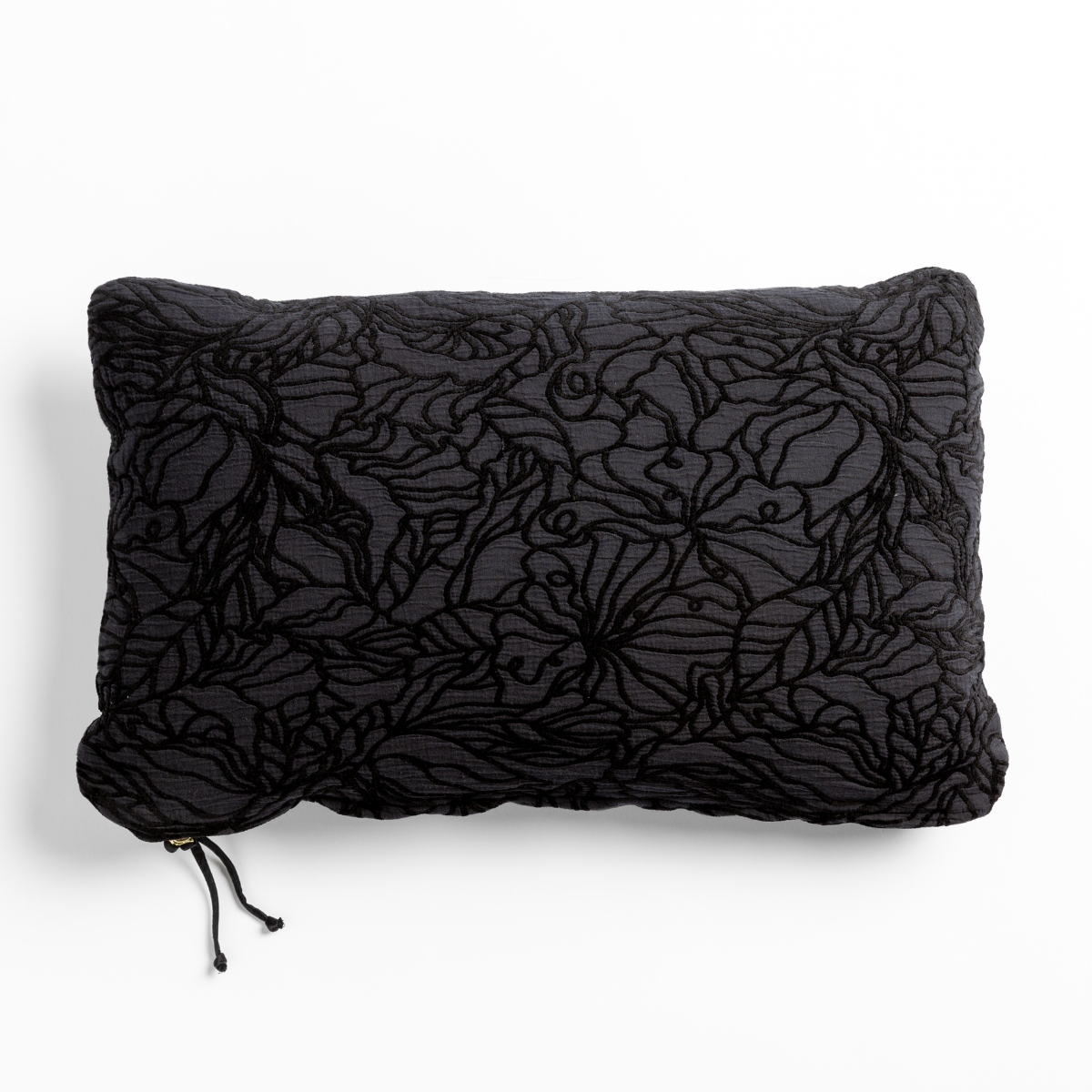 Corvino Georgia throw pillow, close-up showing quilted floral embroidery texture.