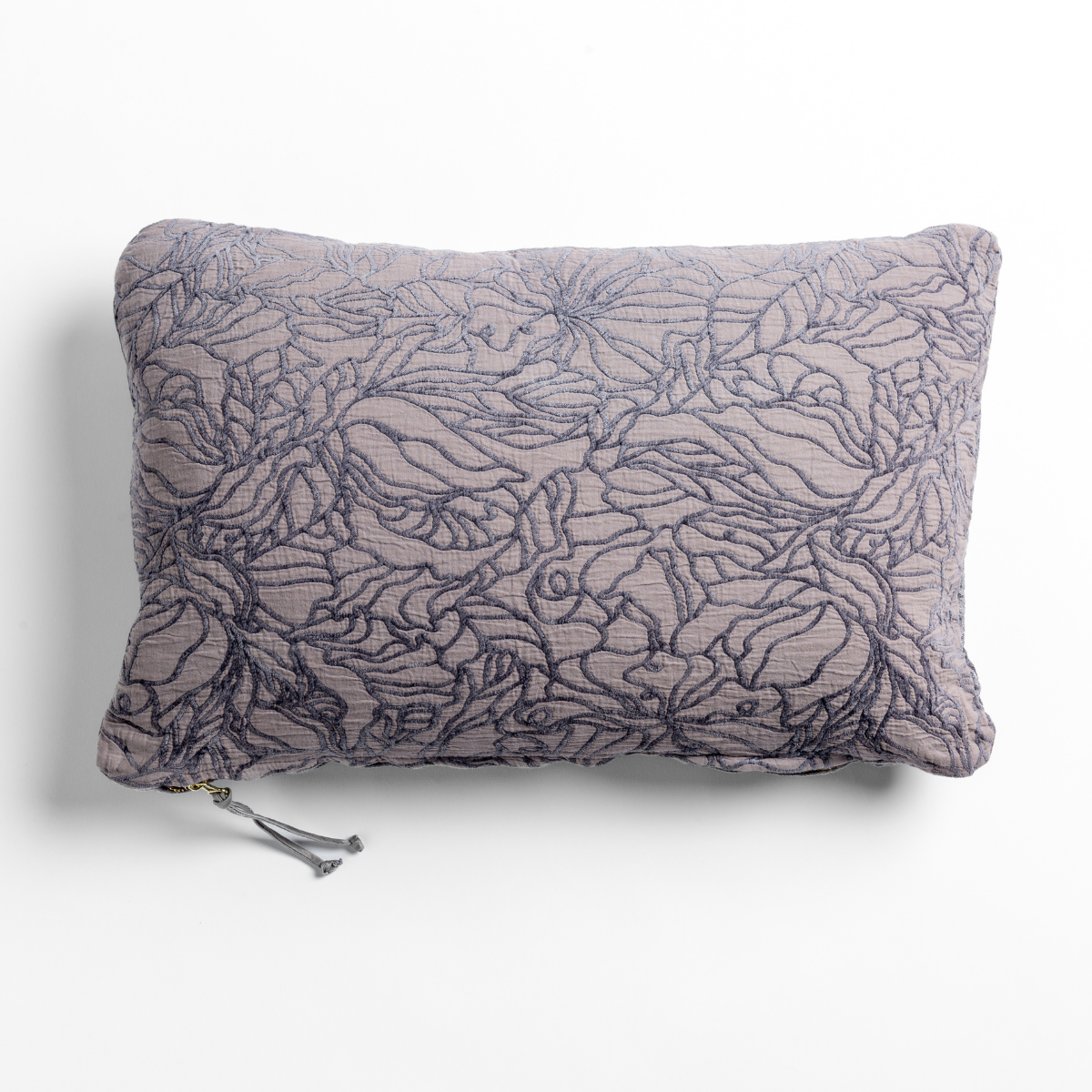 Georgia throw pillow in French Lavender, floral outline embroidery on lumbar cushion with tassel detail.