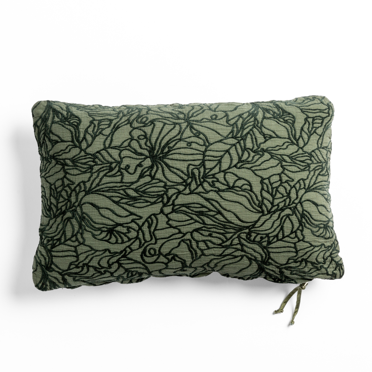 Juniper Georgia throw pillow showing botanical embroidery detail on linen, with tassel tie.