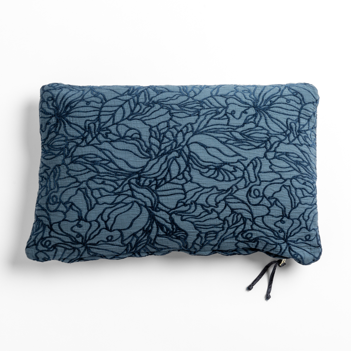 Midnight Georgia throw pillow close-up showing dense floral embroidery on textured linen.