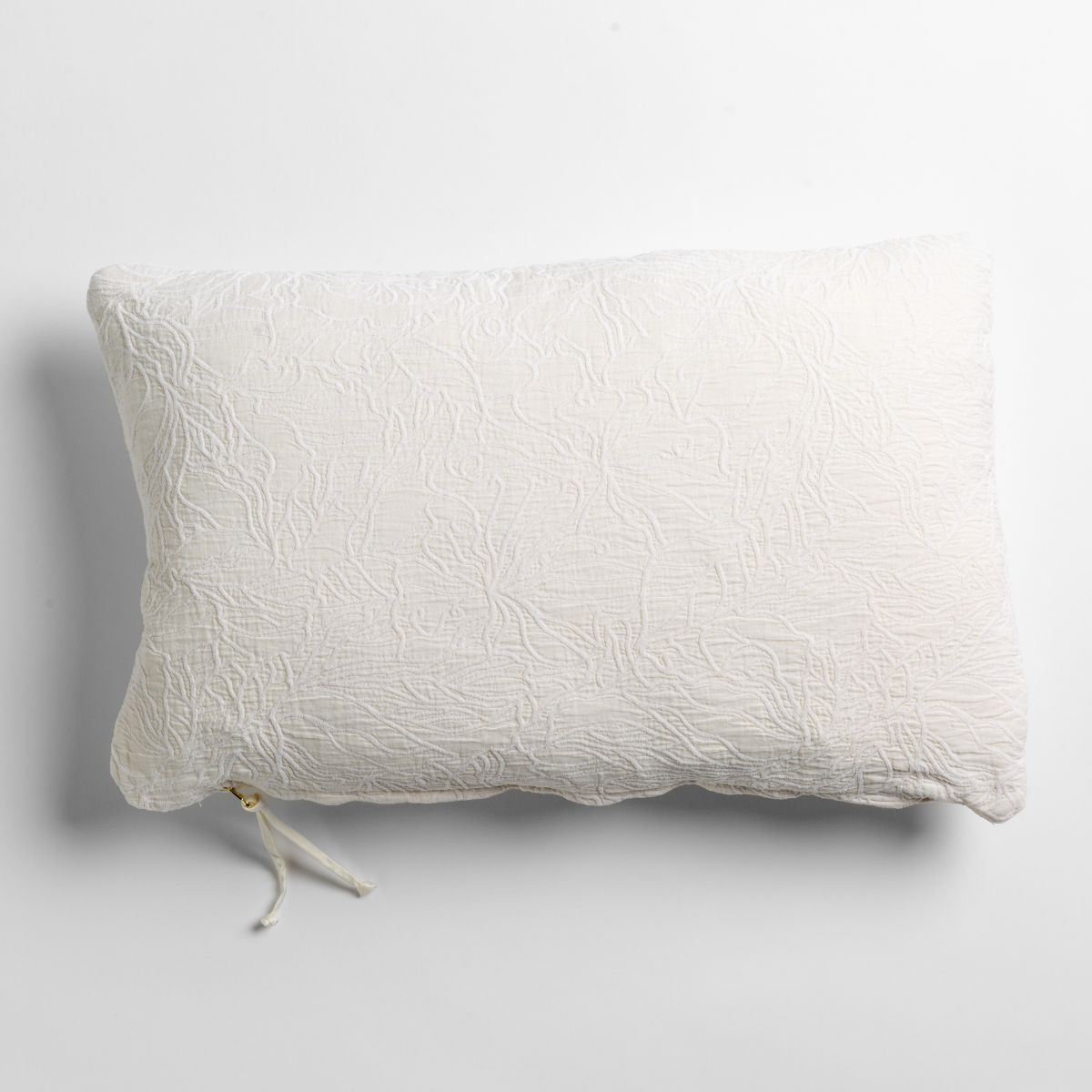 Winter White Georgia throw pillow showing zipper closure detail on light gray background.