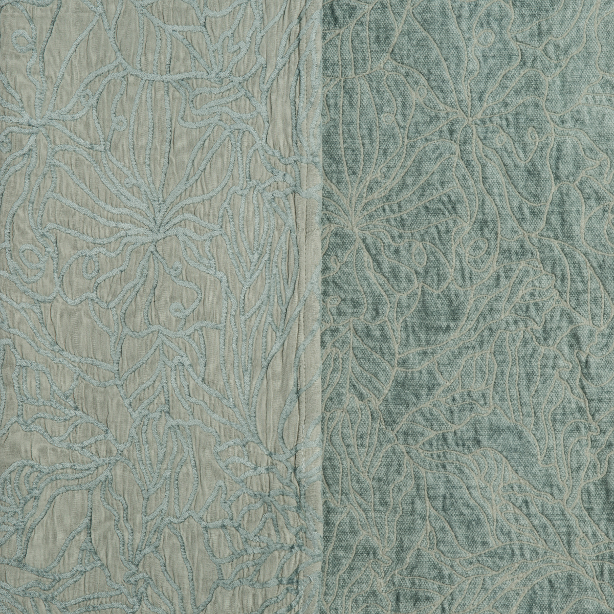 Close-up of Bella Notte Georgia sham in Eucalyptus, showing floral embroidery on two fabric panels.