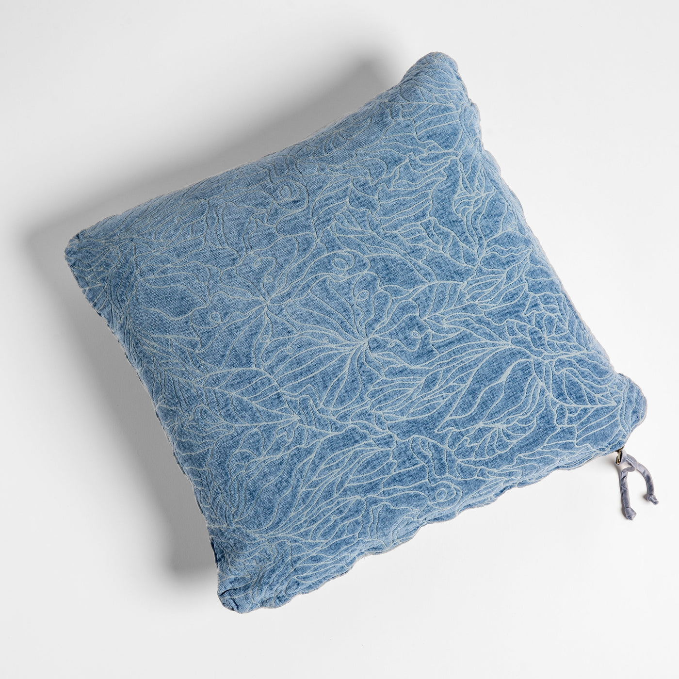 Bella Notte Georgia throw pillow in Tahoe Blue, overhead view showing leaf embroidery and scalloped edge.
