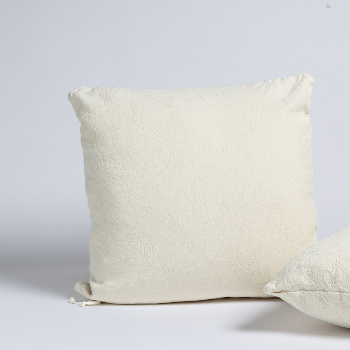 Bella Notte Georgia sham in Natural, showing textured ivory fabric and plump fill from a front angle.