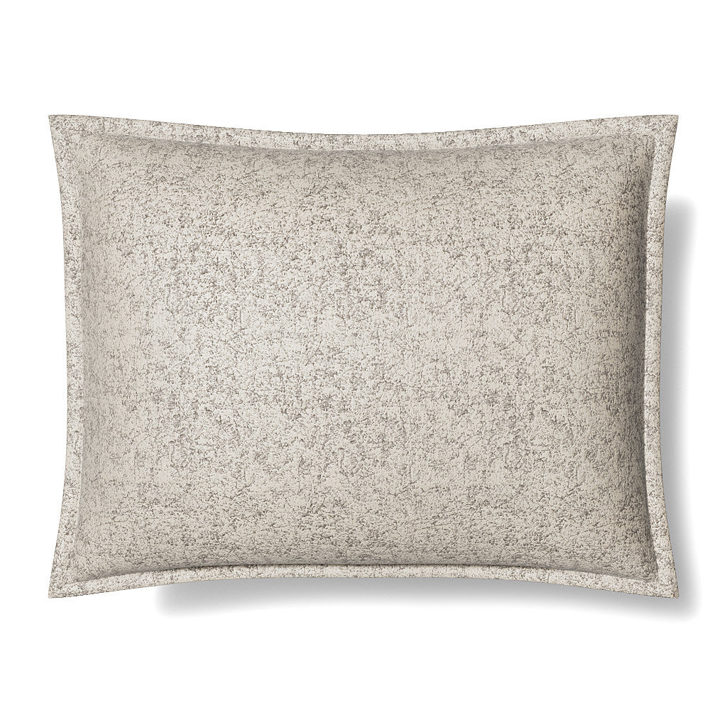 Ann Gish Glacier pillow sham in ivory with speckled grey texture and contrast flange border.