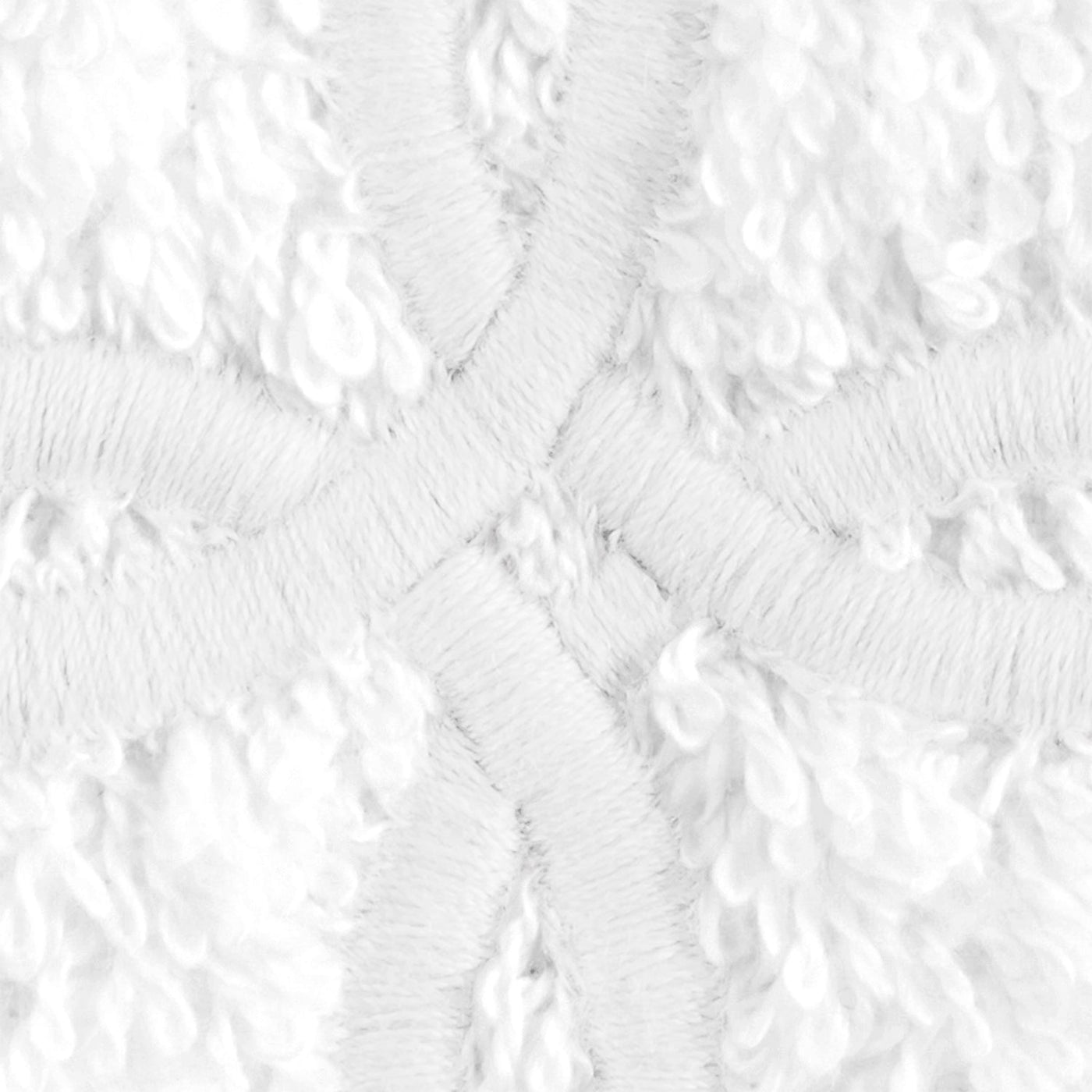 Close-up of Matouk Gordian Knot white terry weave with raised crosshatch embroidery detail.