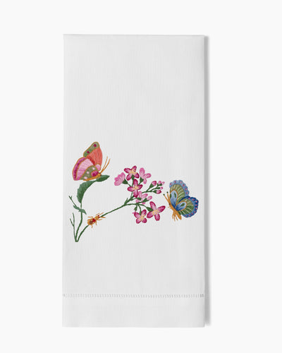 Henry Handwork white linen hand towel with embroidered pink and blue butterflies on floral stem.