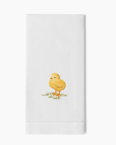 Henry Handwork white linen hand towel with embroidered yellow baby chick on grass.