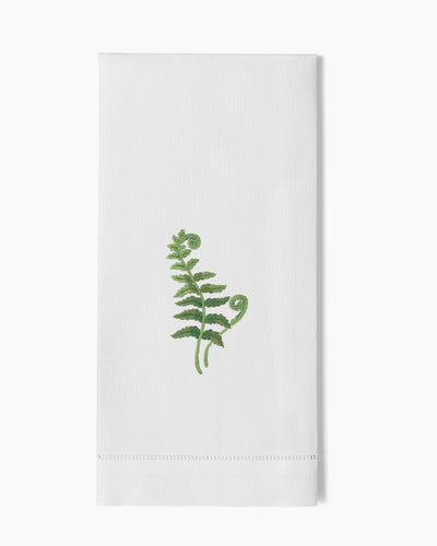 Henry Handwork white linen hand towel with green embroidered fern frond and hemstitch border.