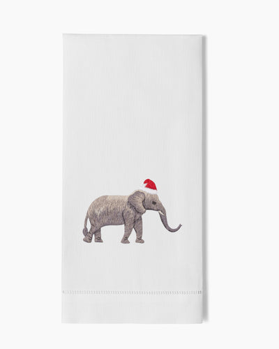 Henry Handwork white linen hand towel with embroidered elephant in red Santa hat.