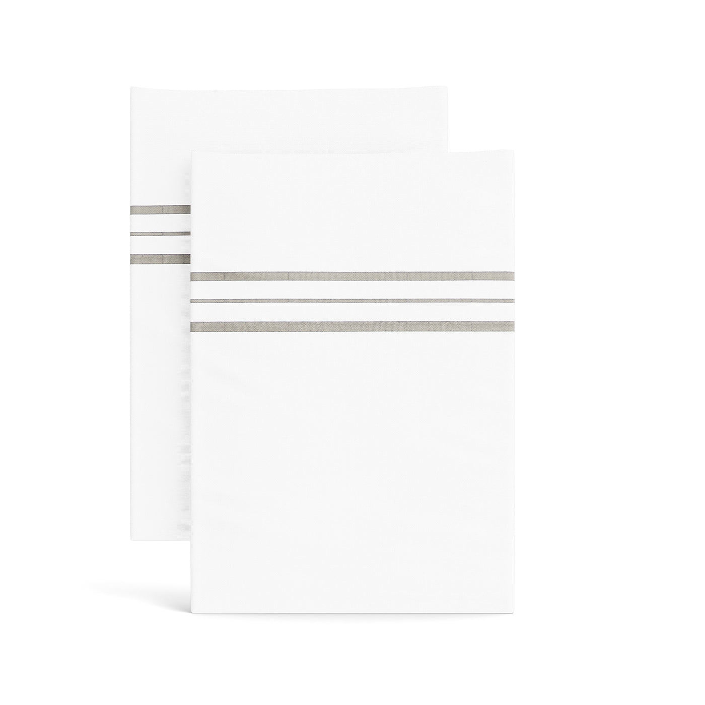 Ann Gish Hem Stripe pillowcases, white with taupe triple-stripe trim, pair stacked.