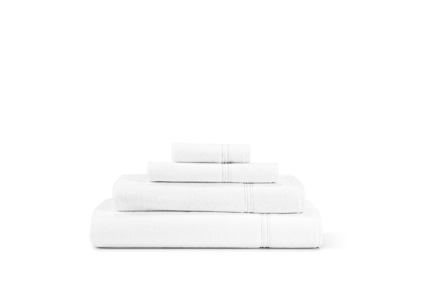 A neatly stacked set of four white Frette Classic Hand Towels against a plain white background, highlighting the luxury bath collection from Frette.
