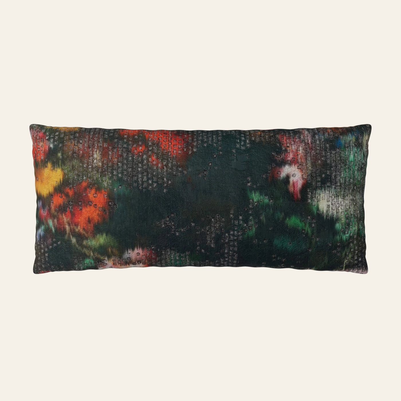 Ann Gish Ibiza lumbar pillow in dark floral abstract print with red, green, and yellow.