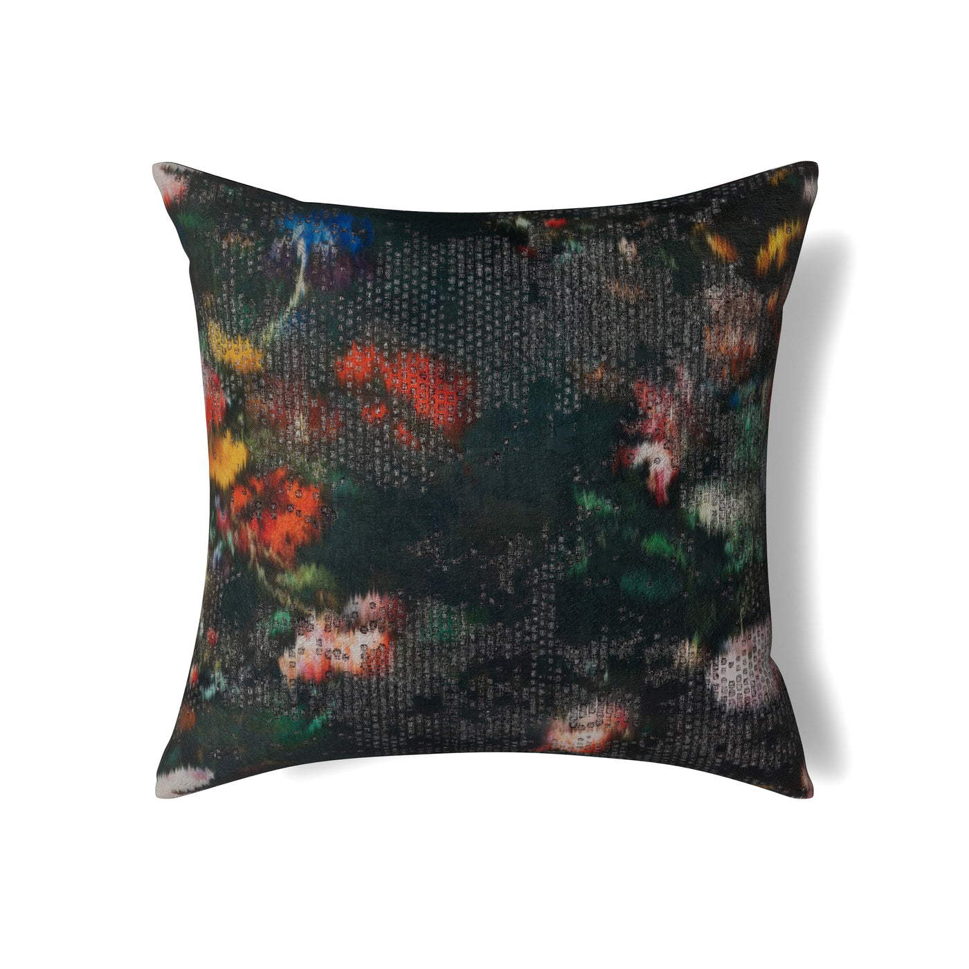 Ann Gish Ibiza pillow, dark ground with blurred floral print in red, orange, and green.