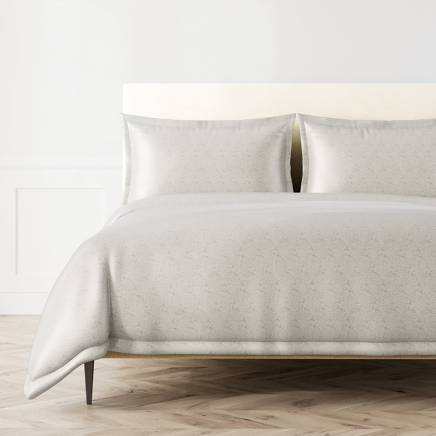 Ann Gish Imprint duvet set in ivory, styled on a bed with two matching shams.