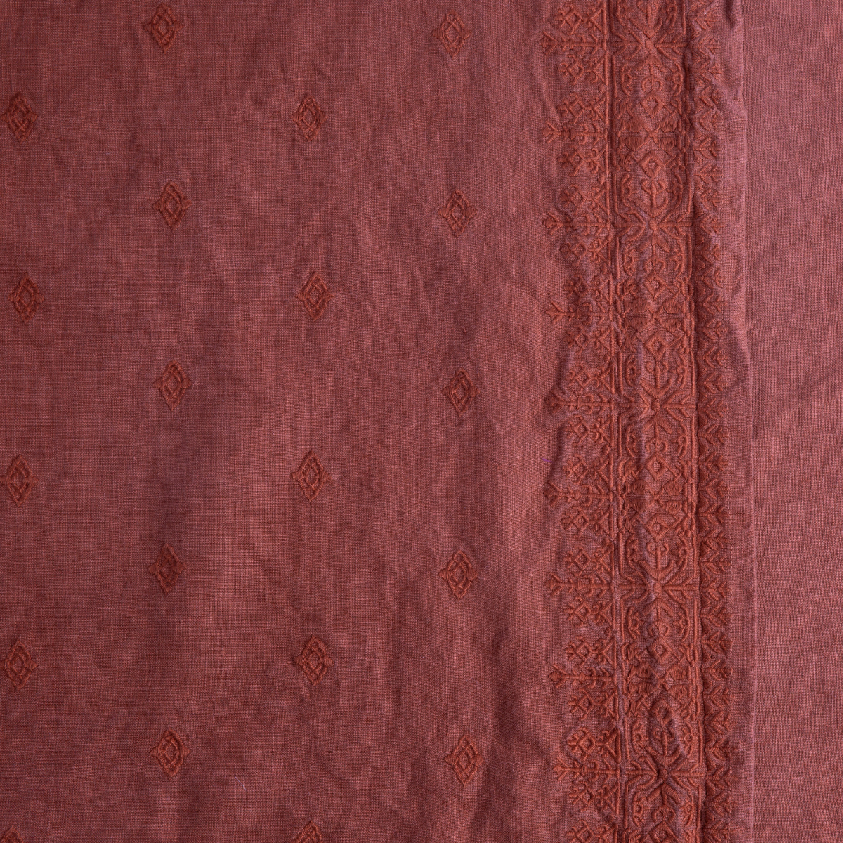 Close-up of Bella Notte Ines duvet cover in Autumn, showing diamond embroidery and ornate border trim.