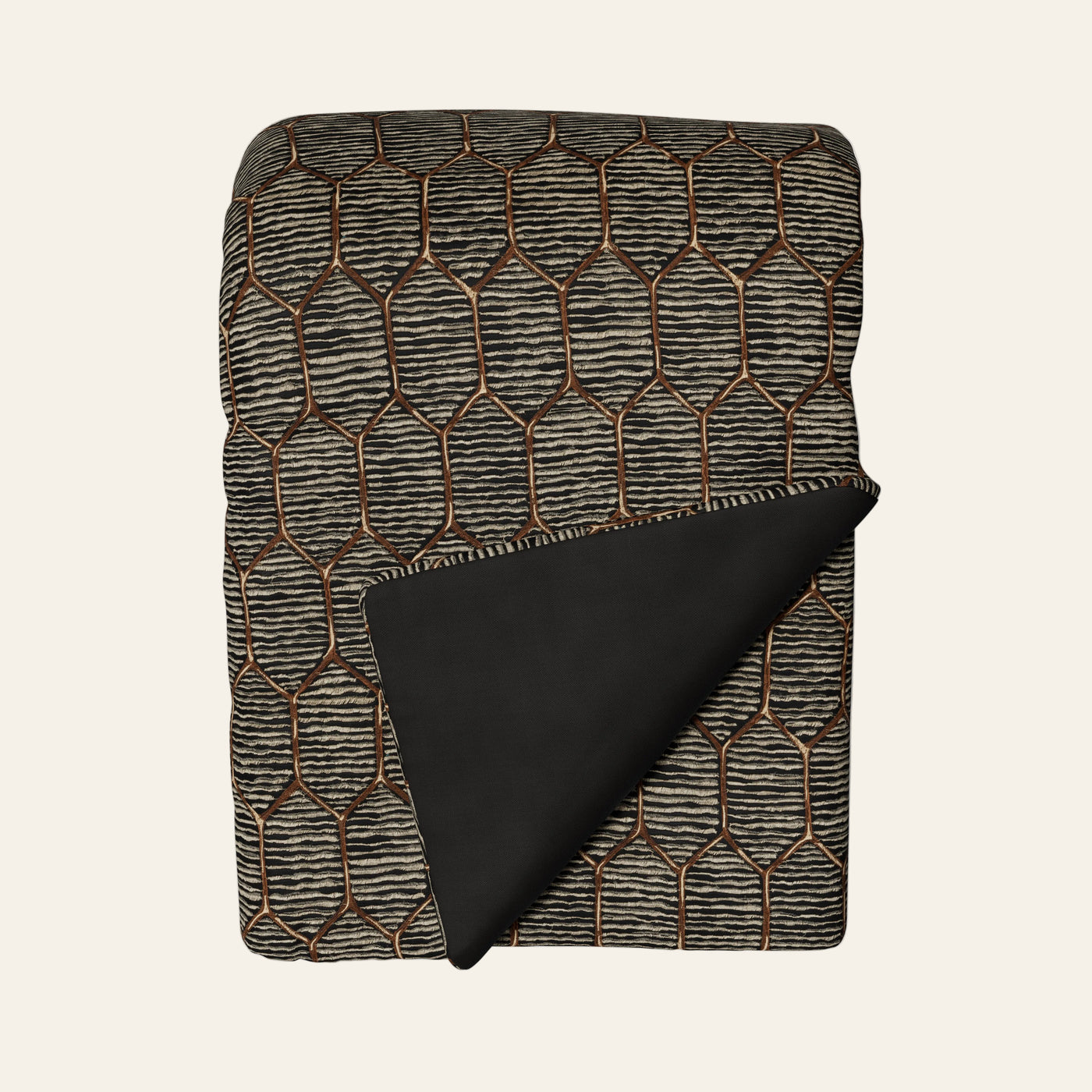 Ann Gish Inro throw in charcoal with bronze geometric lattice pattern, black reverse shown folded.