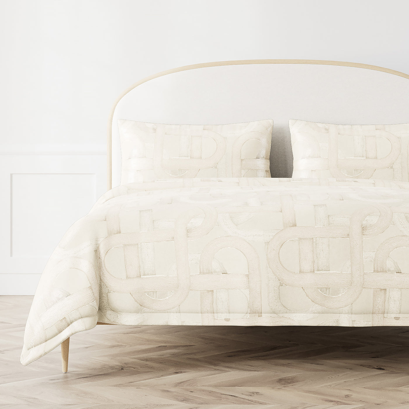 Ann Gish Interchange duvet cover in ivory with geometric loop pattern on styled bed.