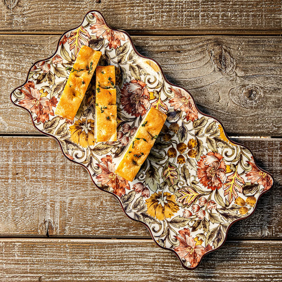 Juliska Willa hostess tray with herbed focaccia on a weathered wood table