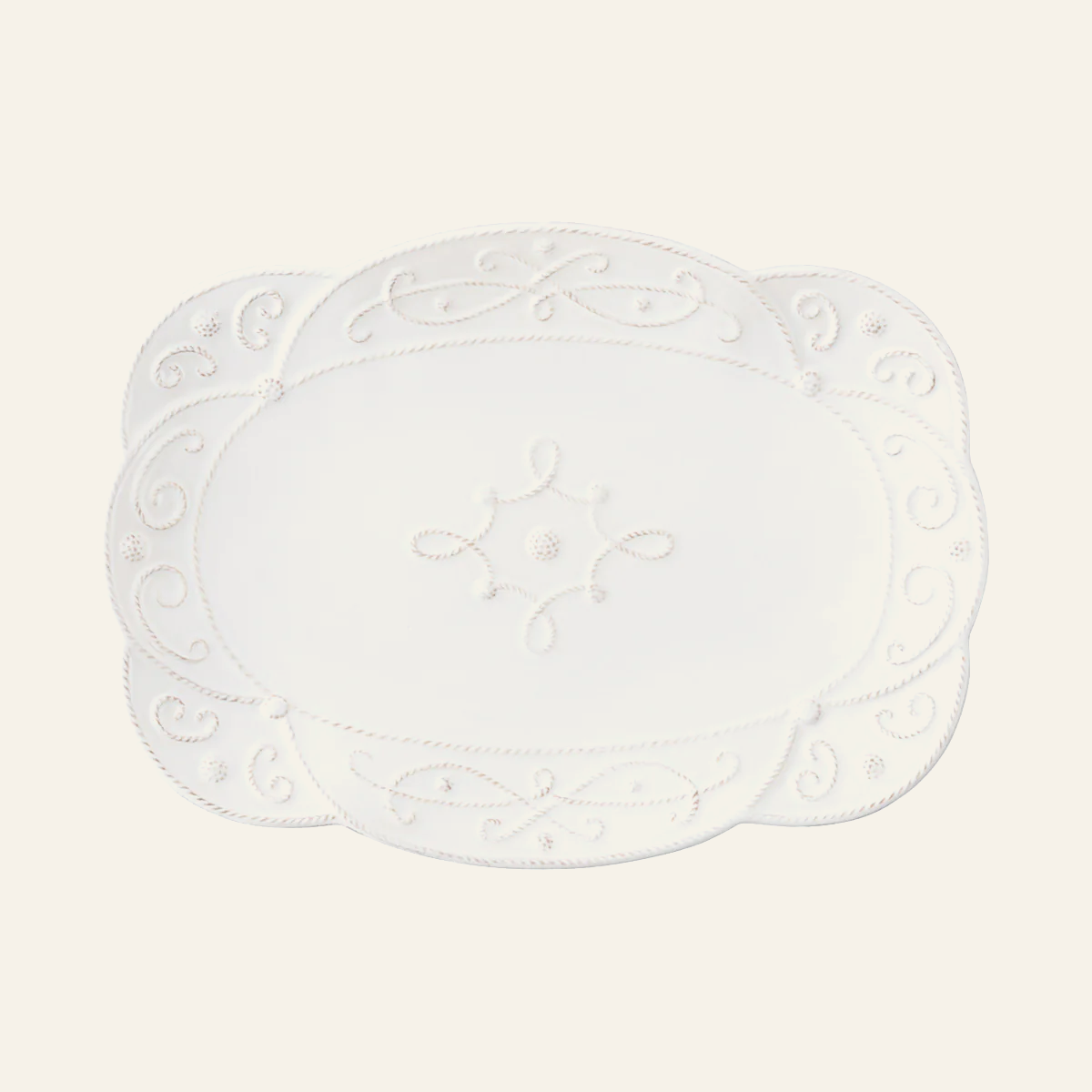 Juliska Jardins du Monde white ceramic platter with scrollwork and scalloped edge.