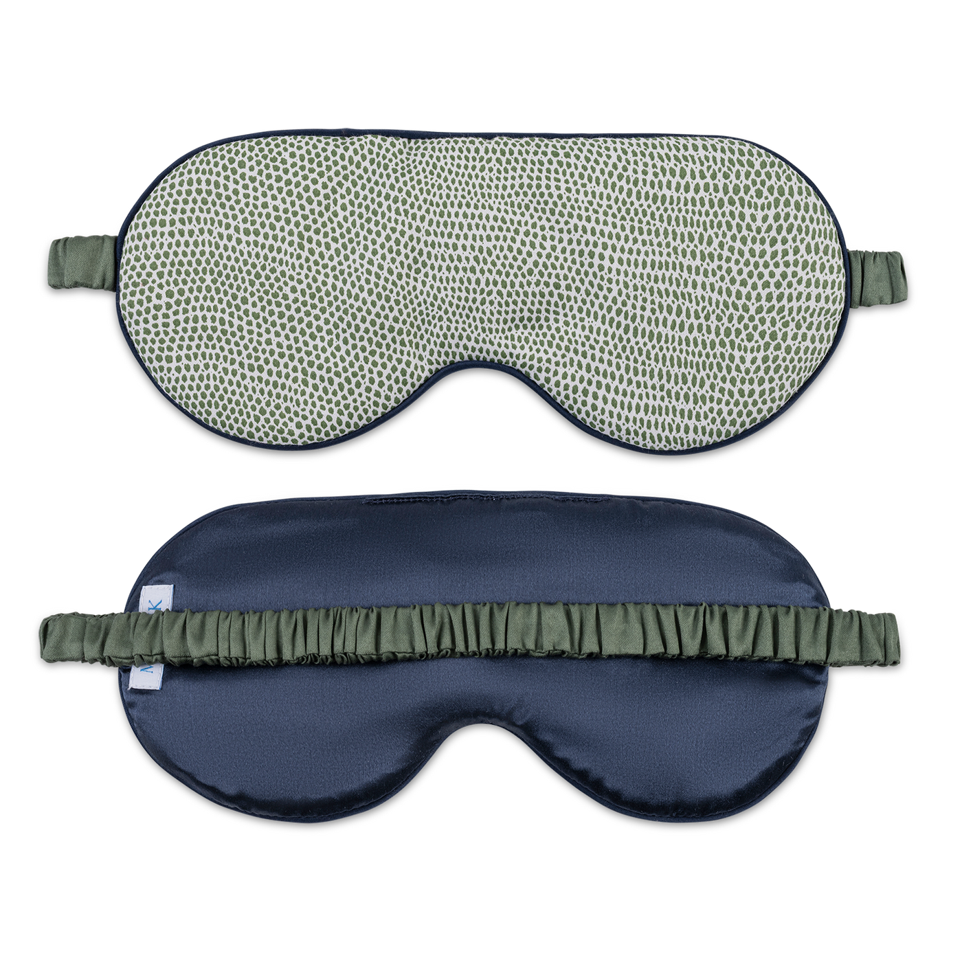 Navy silk sleep mask reverse side with olive ruffled elastic strap, shown alongside patterned front.