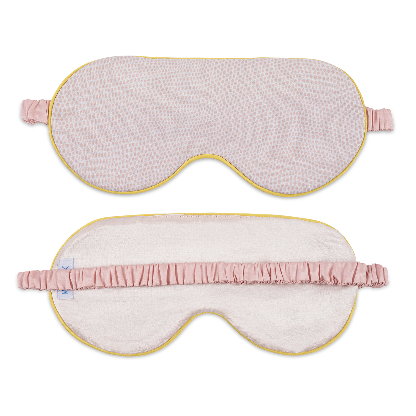 Front and back views of Matouk Jasper sleep mask in blush with gold piping.