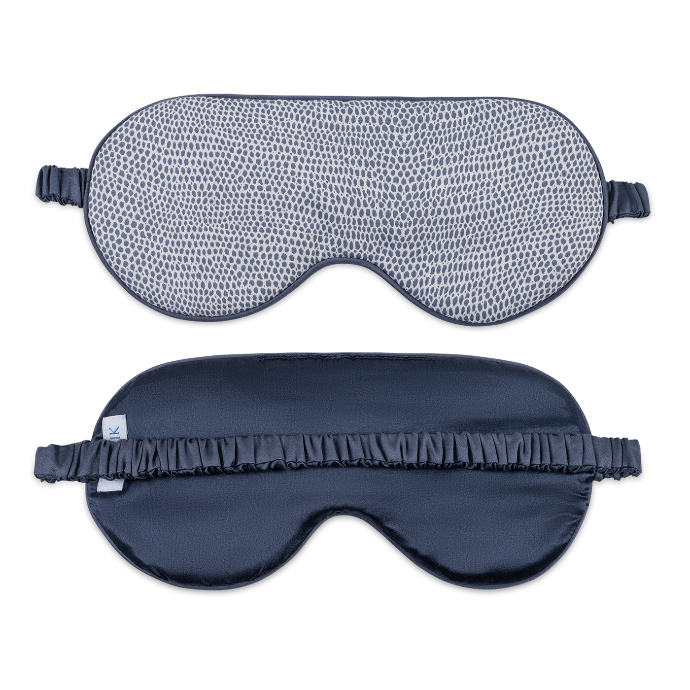 Front and back views of Matouk Jasper sleep mask in navy with dotted pattern.