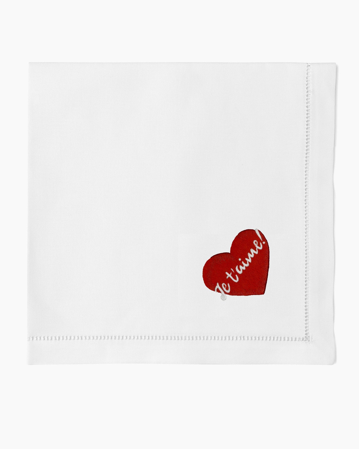 Henry Handwork Je T'Aime white linen dinner napkin with red embroidered heart.