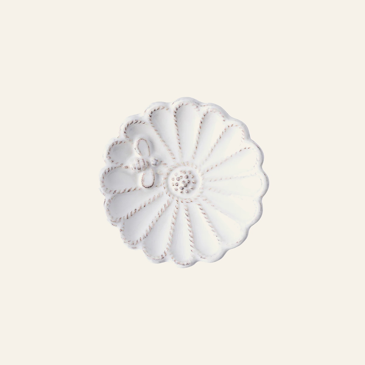 Juliska Jardins du Monde white ceramic blossom dish with scalloped floral relief detail.