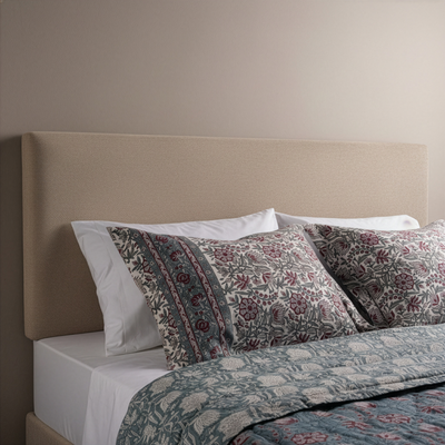 Close-up of Henry Handwork Kyoto floral block-print shams in dusty rose and sage.