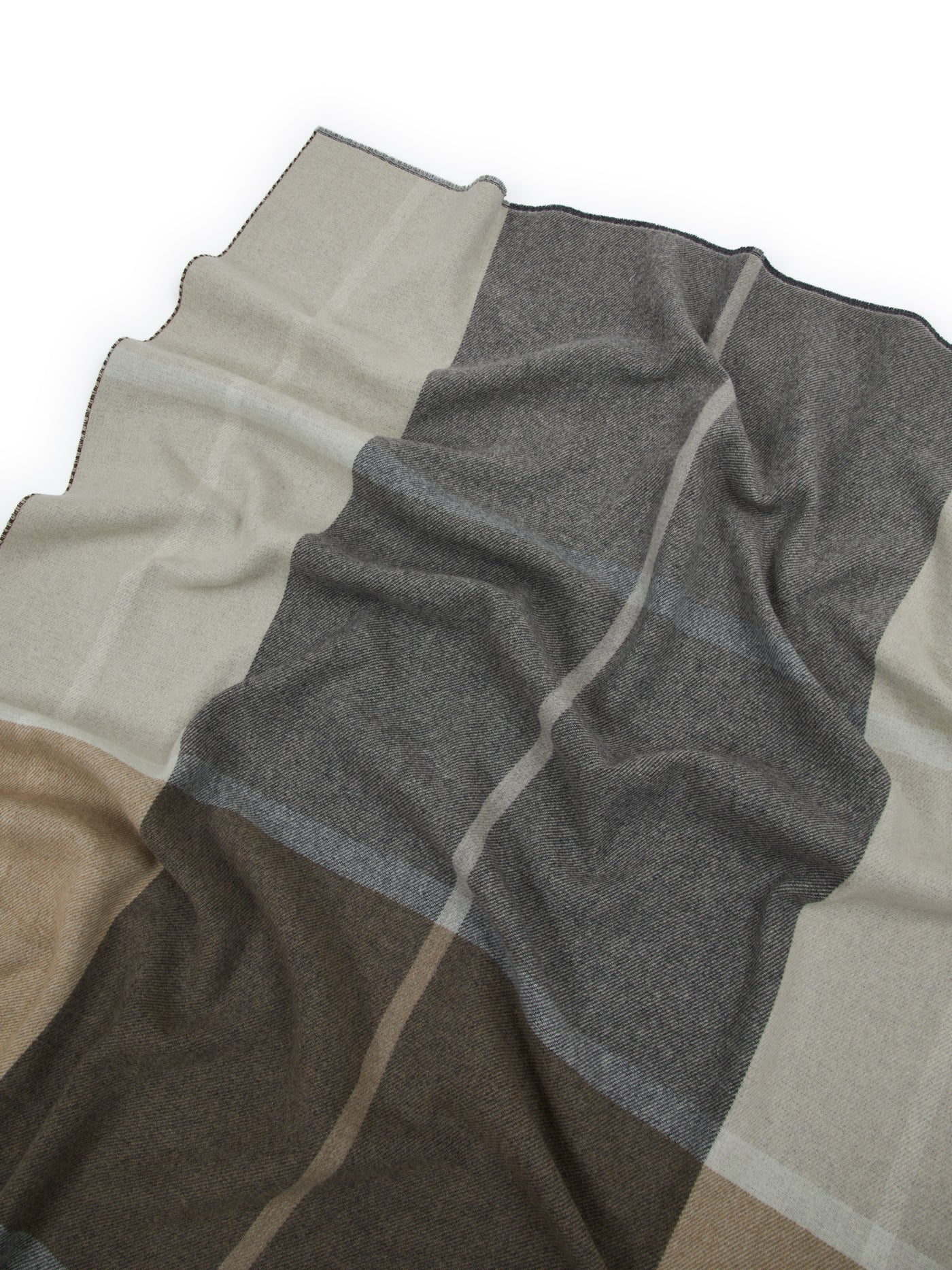 Close-up of Lanerossi Ascot throw, color-block pattern in charcoal, taupe, and ivory wool.
