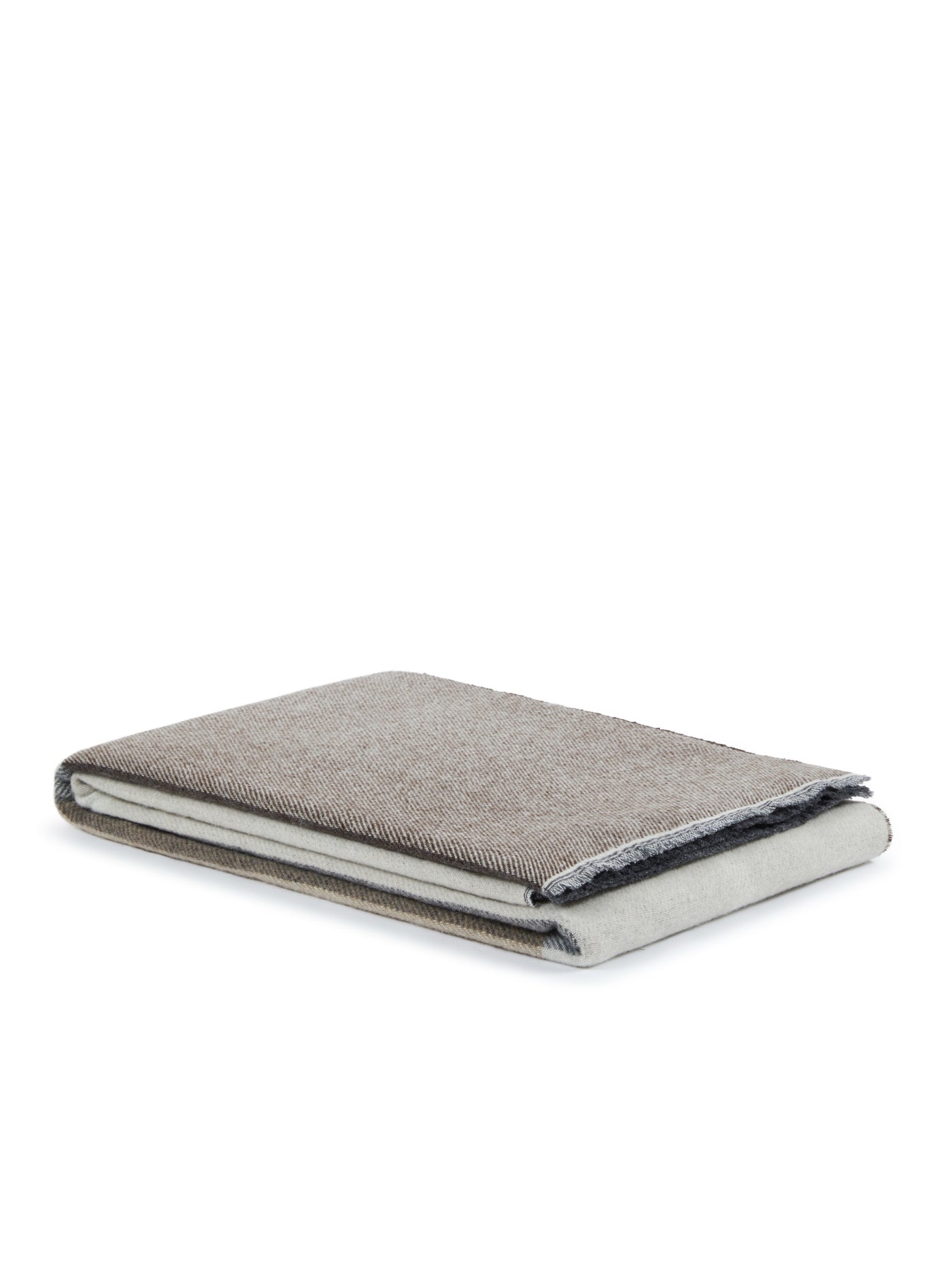 Folded taupe herringbone throw with contrast navy edge trim, angled product view.