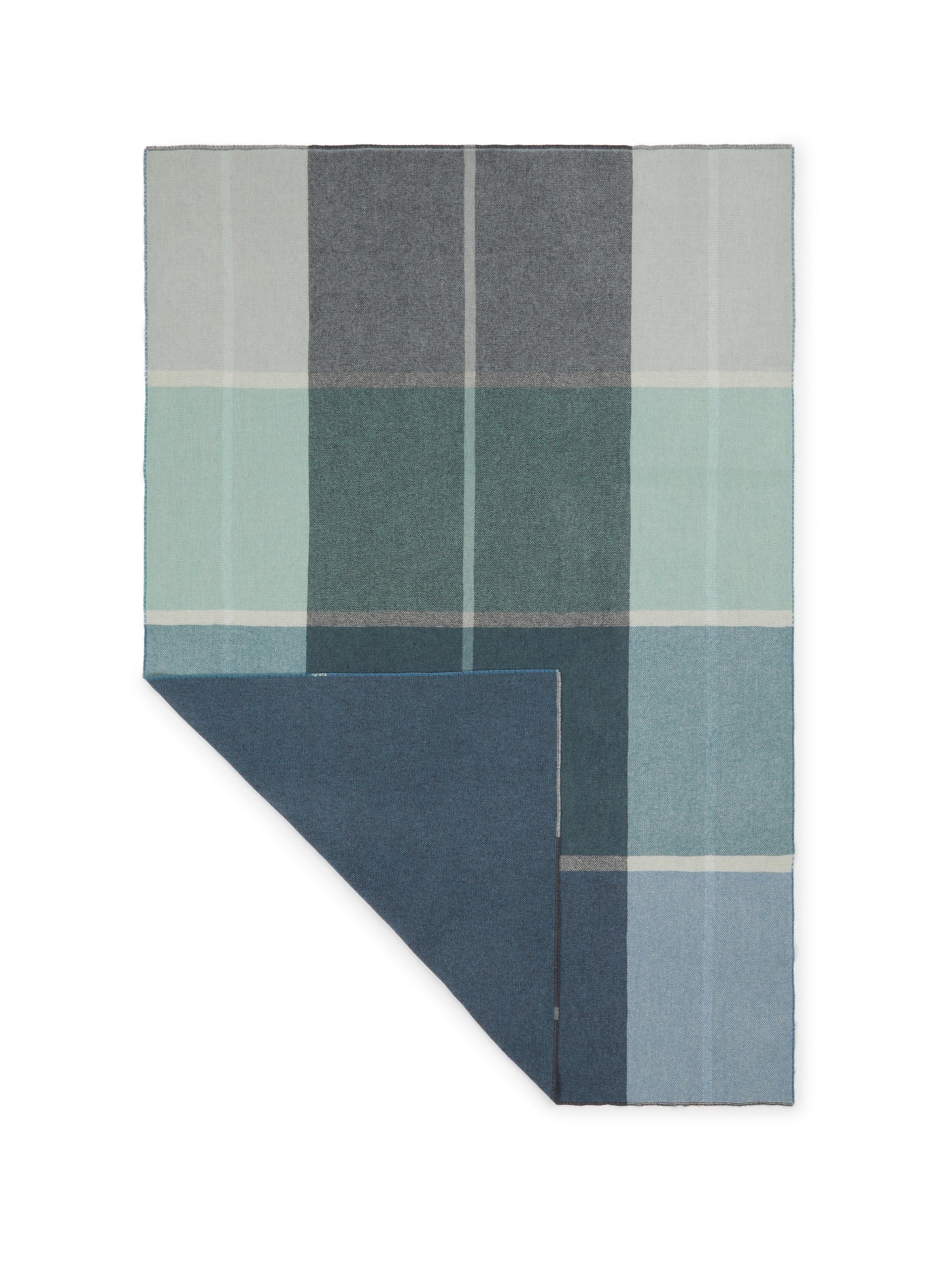 Reverse side detail of Lanerossi Ascot throw showing navy blue lining and plaid pattern.