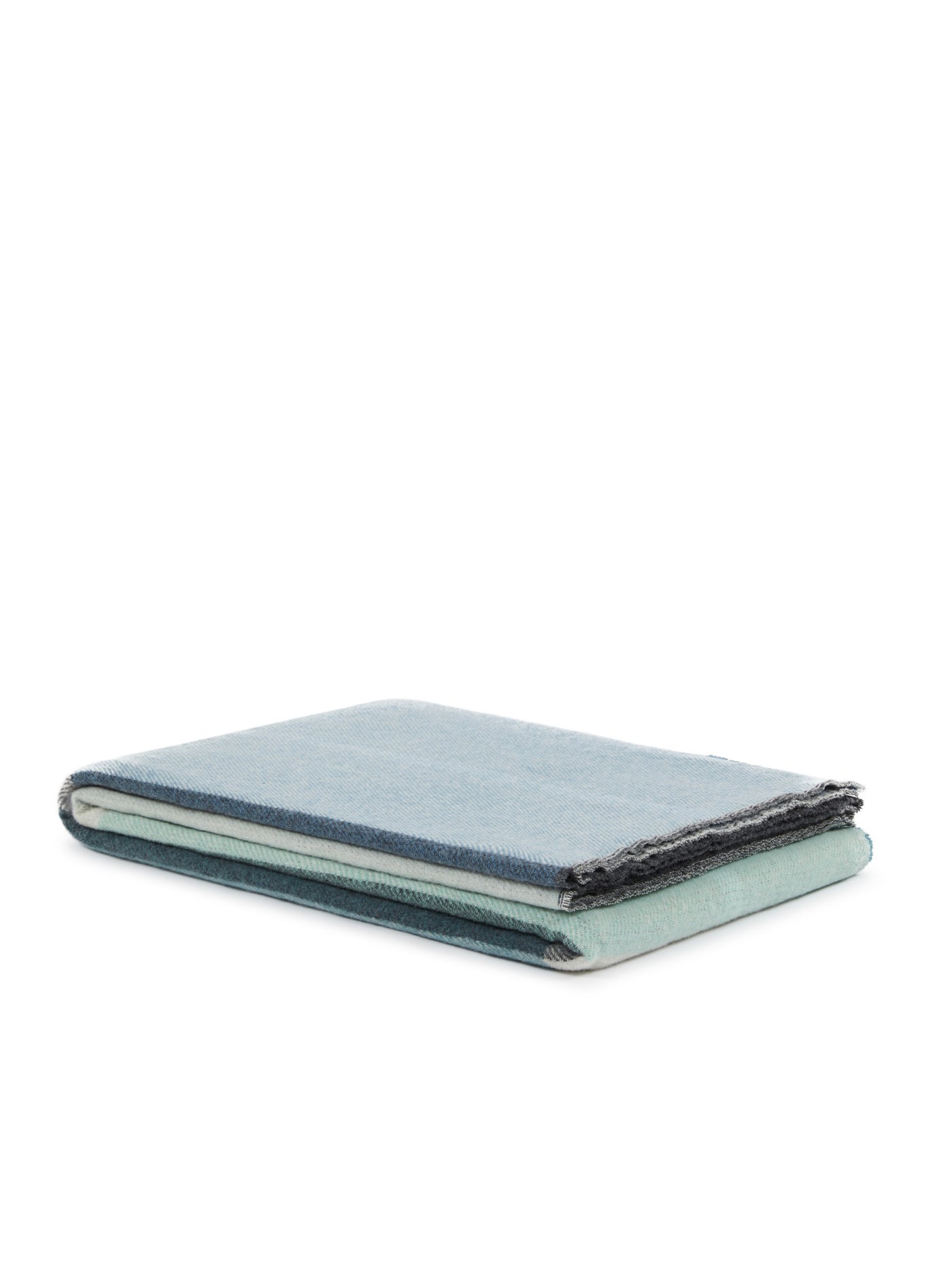 Close-up of folded Lanerossi Ascot throw showing slate blue top and sage green underside with frayed edges.