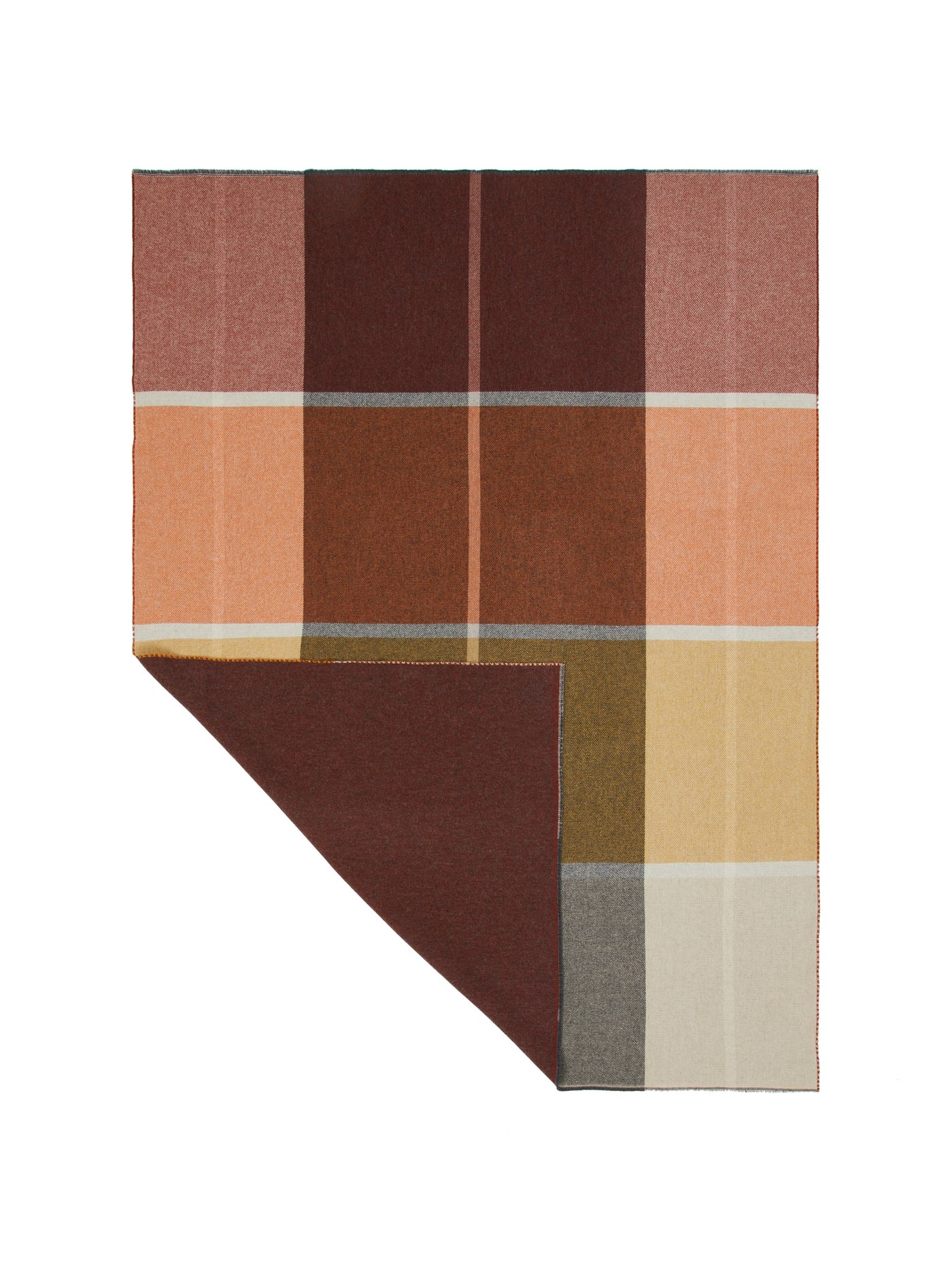 Folded corner revealing burgundy reverse of Ascot throw with geometric colorblock pattern.