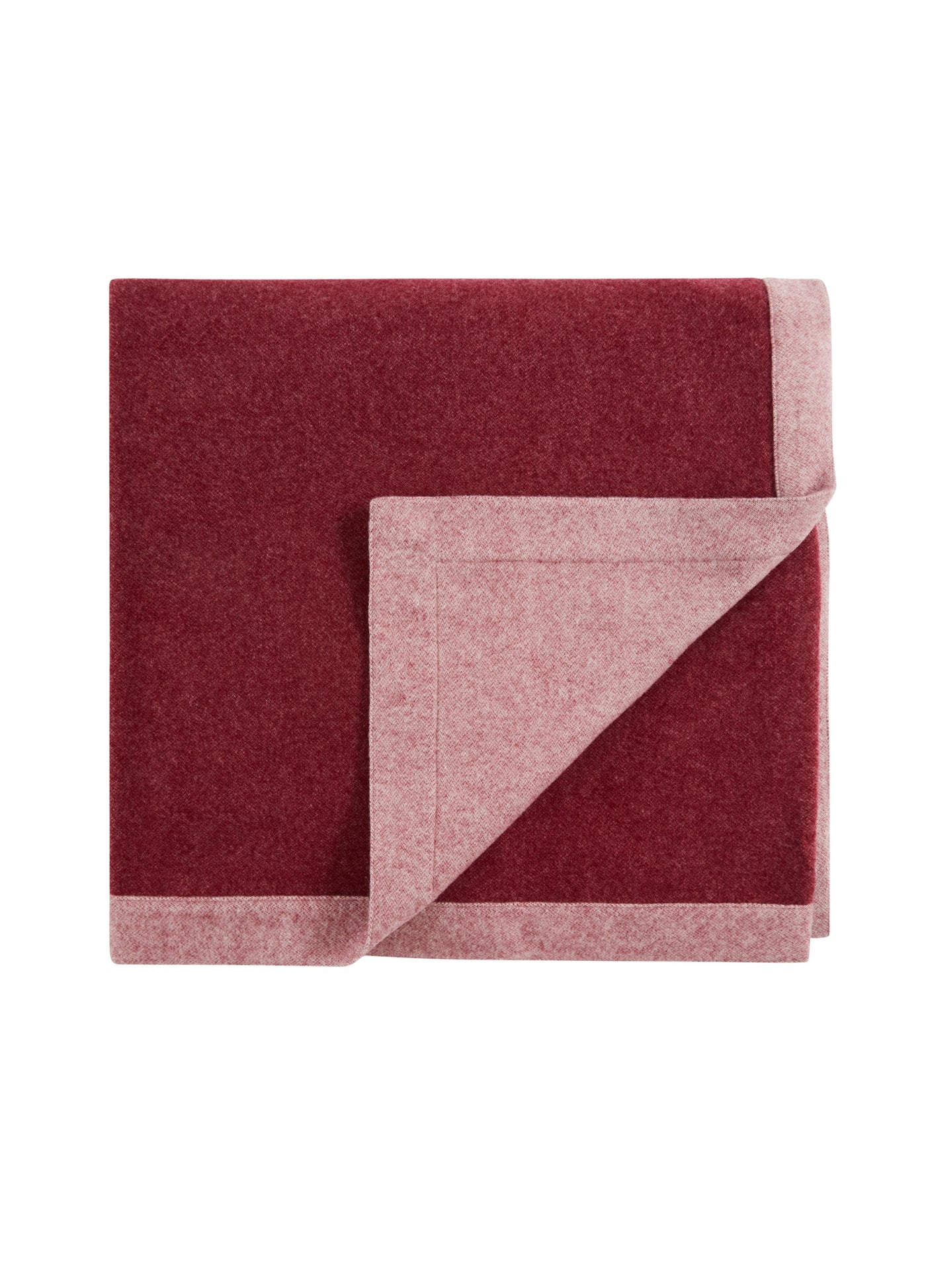 Reversible wool blanket folded to show crimson face and blush pink reverse.