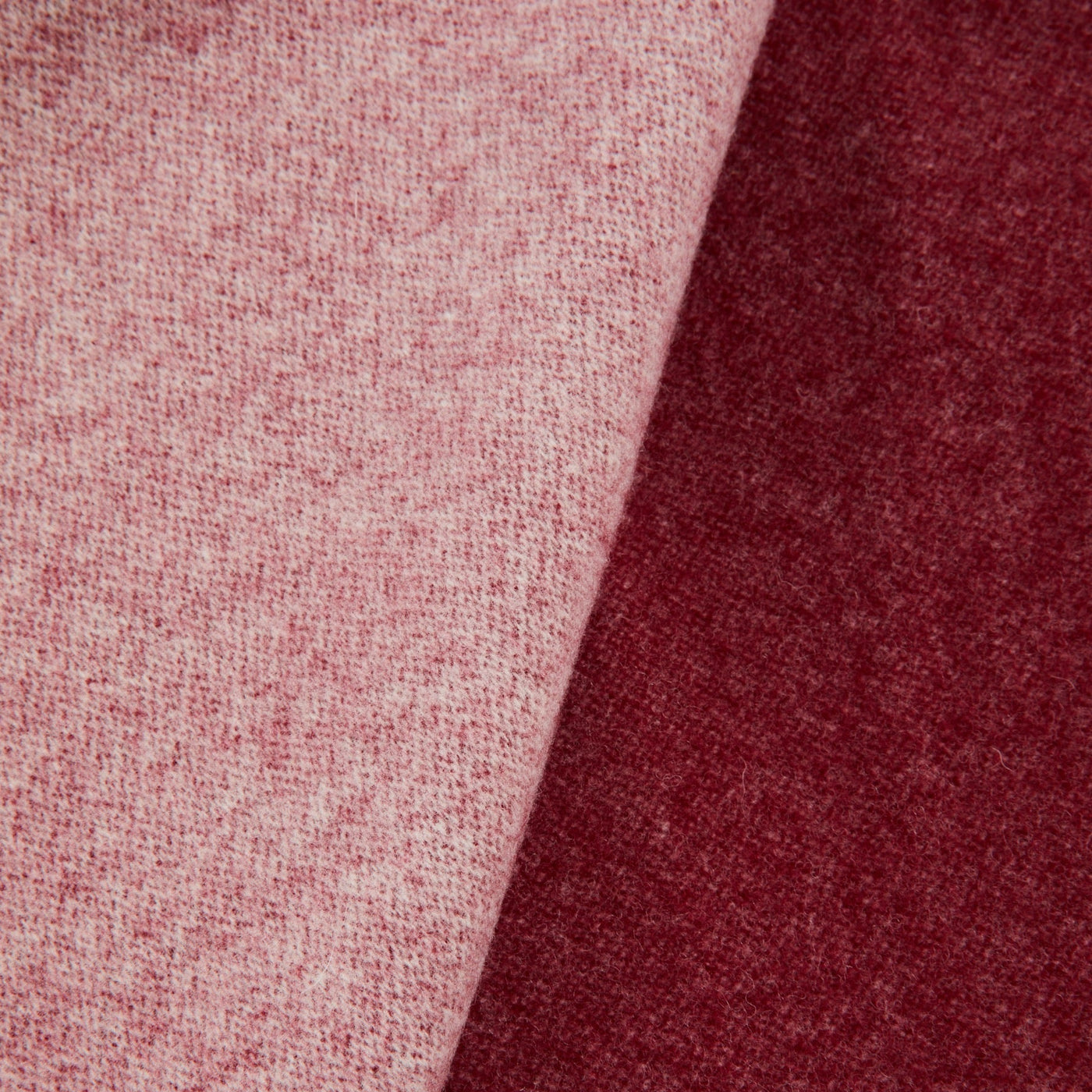 Close-up of Lanerossi Afrodite blanket showing blush and burgundy reversible wool weave.