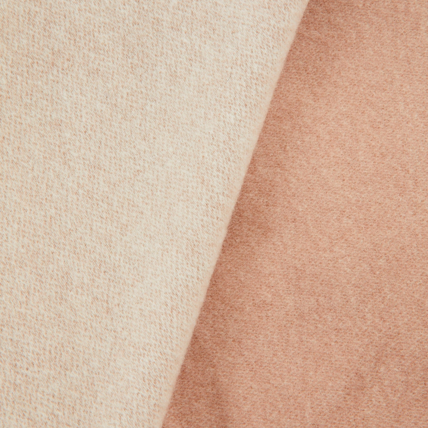 Close-up of Lanerossi Afrodite blanket showing ivory and blush reversible wool fabric texture.
