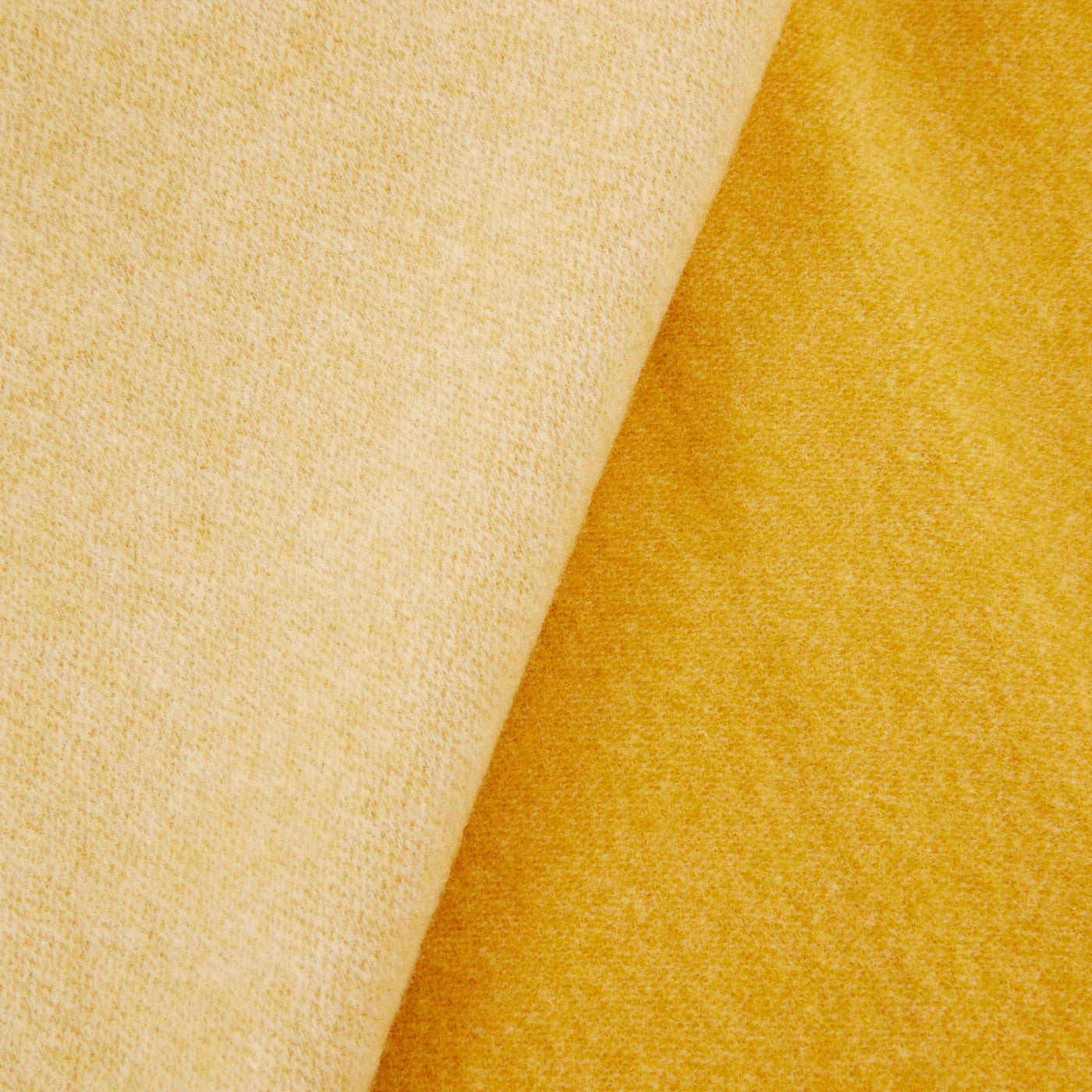 Close-up of Lanerossi Afrodite blanket showing contrast between marigold and pale gold reversible sides.