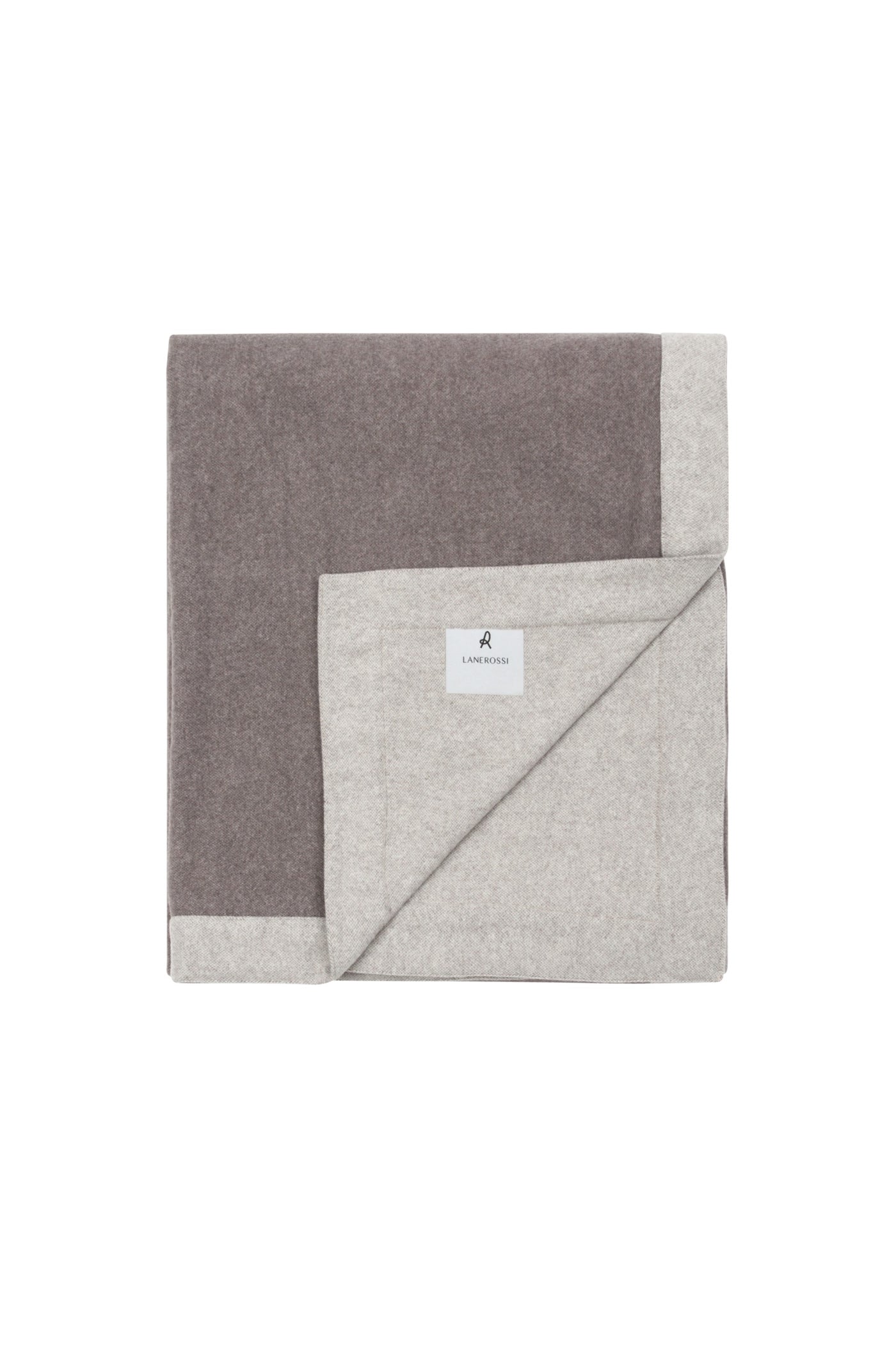 Folded corner detail revealing taupe and oatmeal reversible wool blanket with woven label.