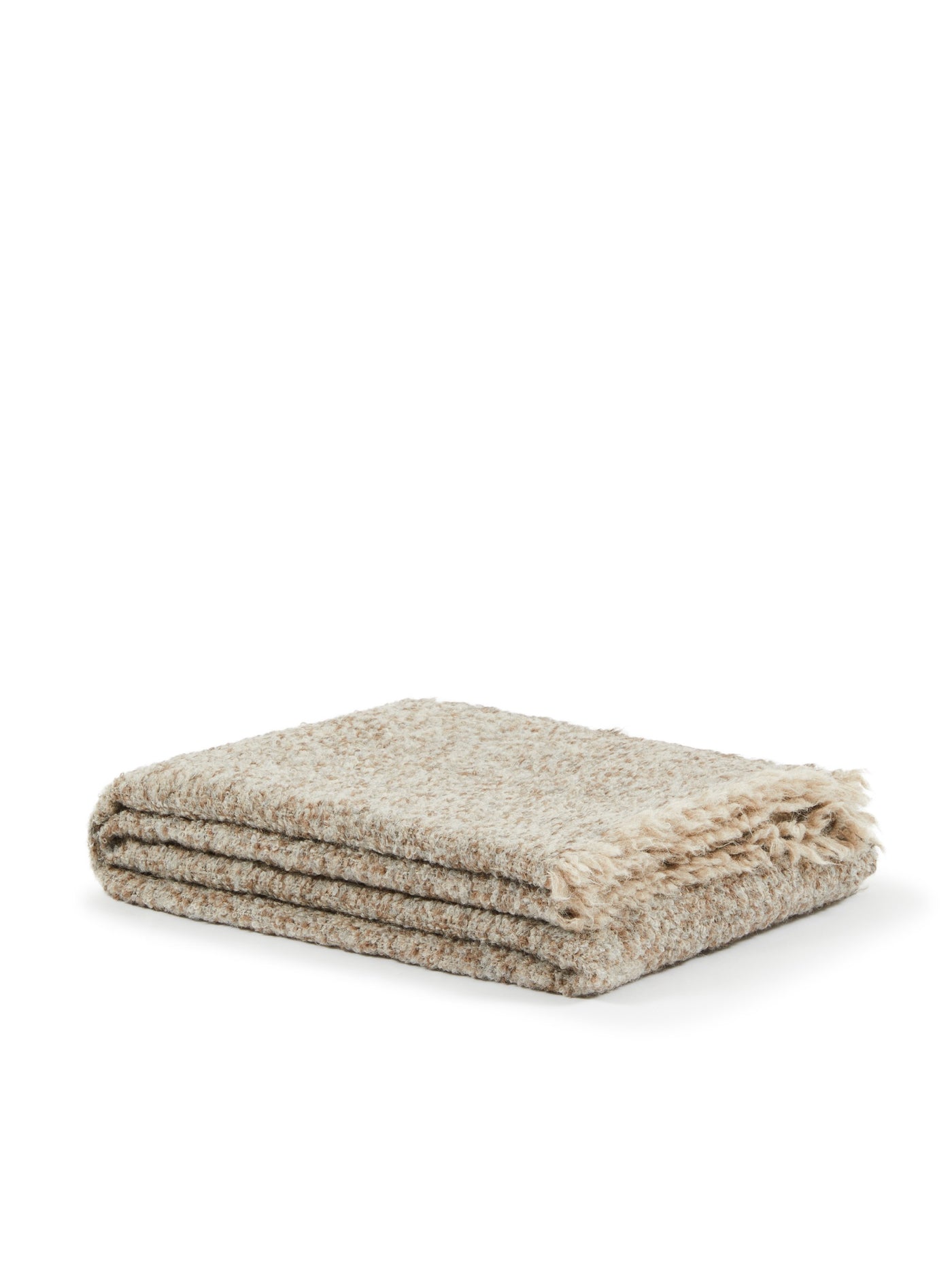 Lanerossi Bogotà throw folded, showing oatmeal boucle texture and fringe trim detail.