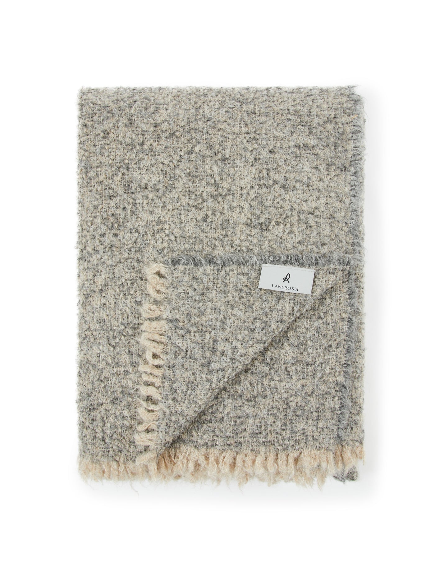 Lanerossi Bogotà throw folded, showing ivory fringe edge and woven label detail.